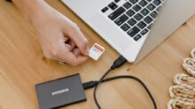 person holding black and silver laptop computer