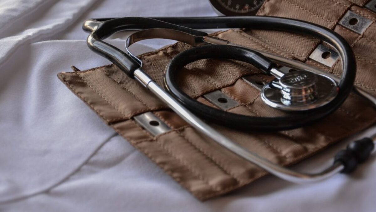 black stethoscope with brown leather case