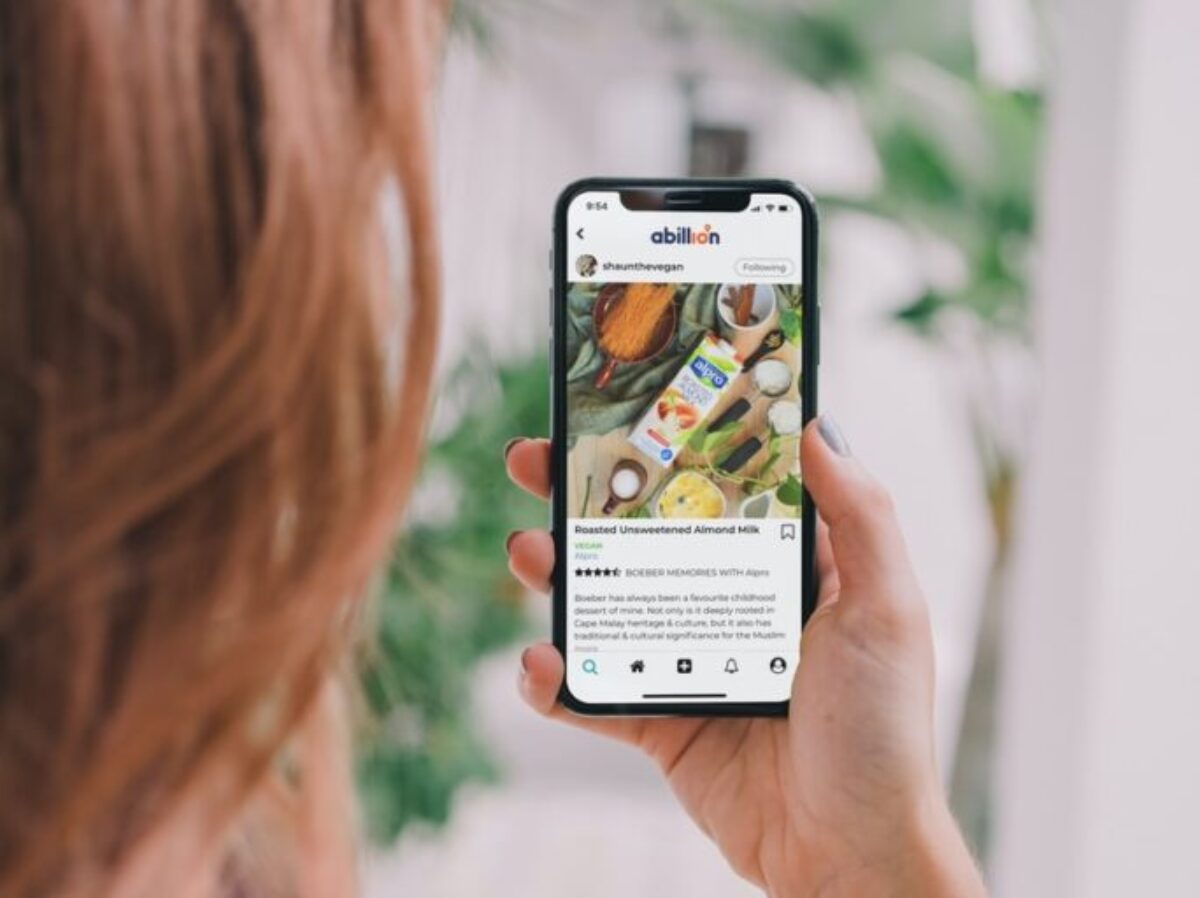 woman holding white samsung android smartphone