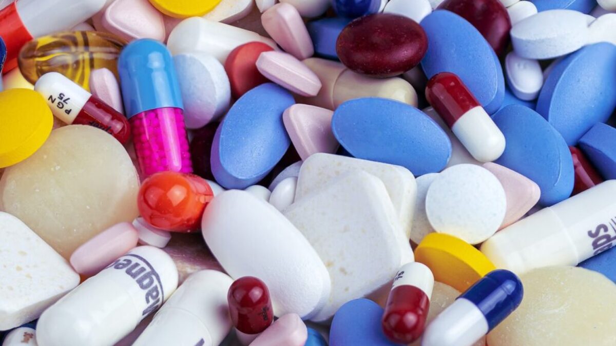 white blue and orange medication pill