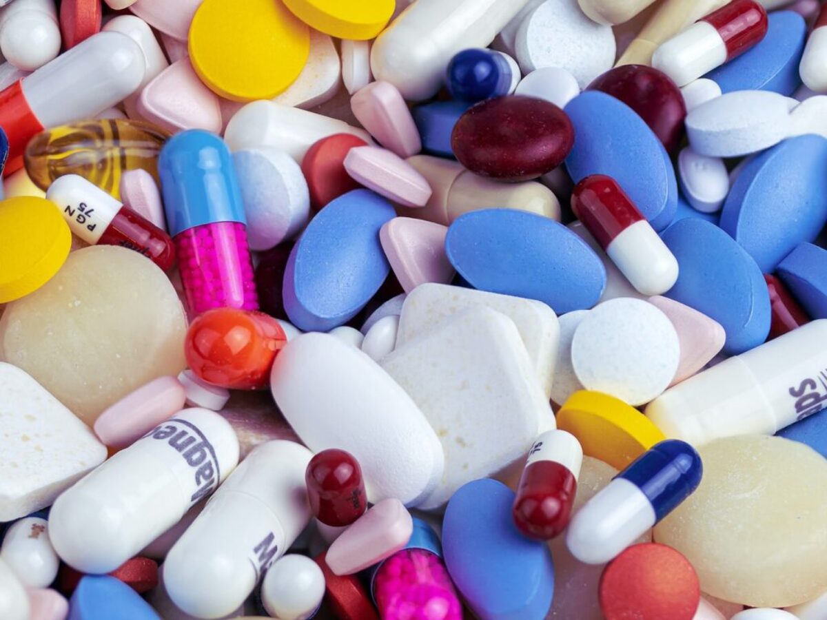 white blue and orange medication pill