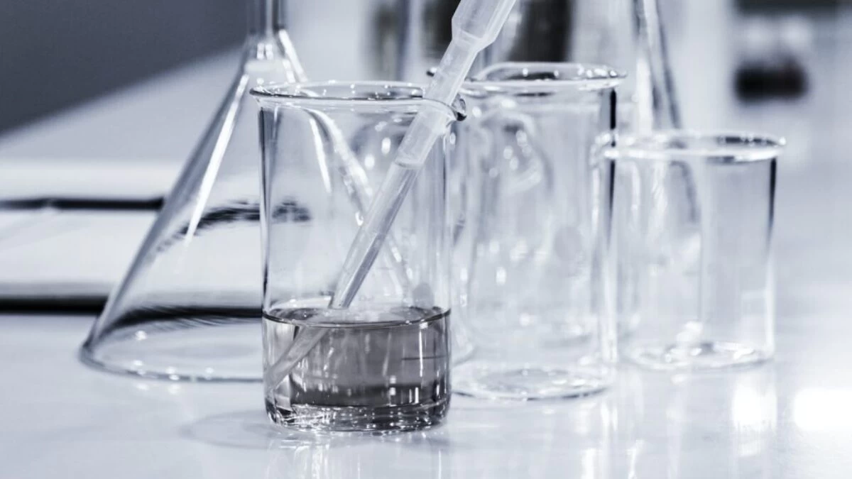 three clear beakers placed on tabletop
