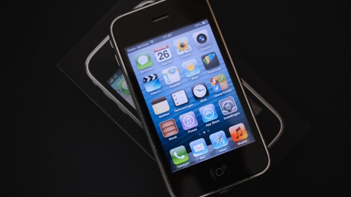 black iphone 4 on white table