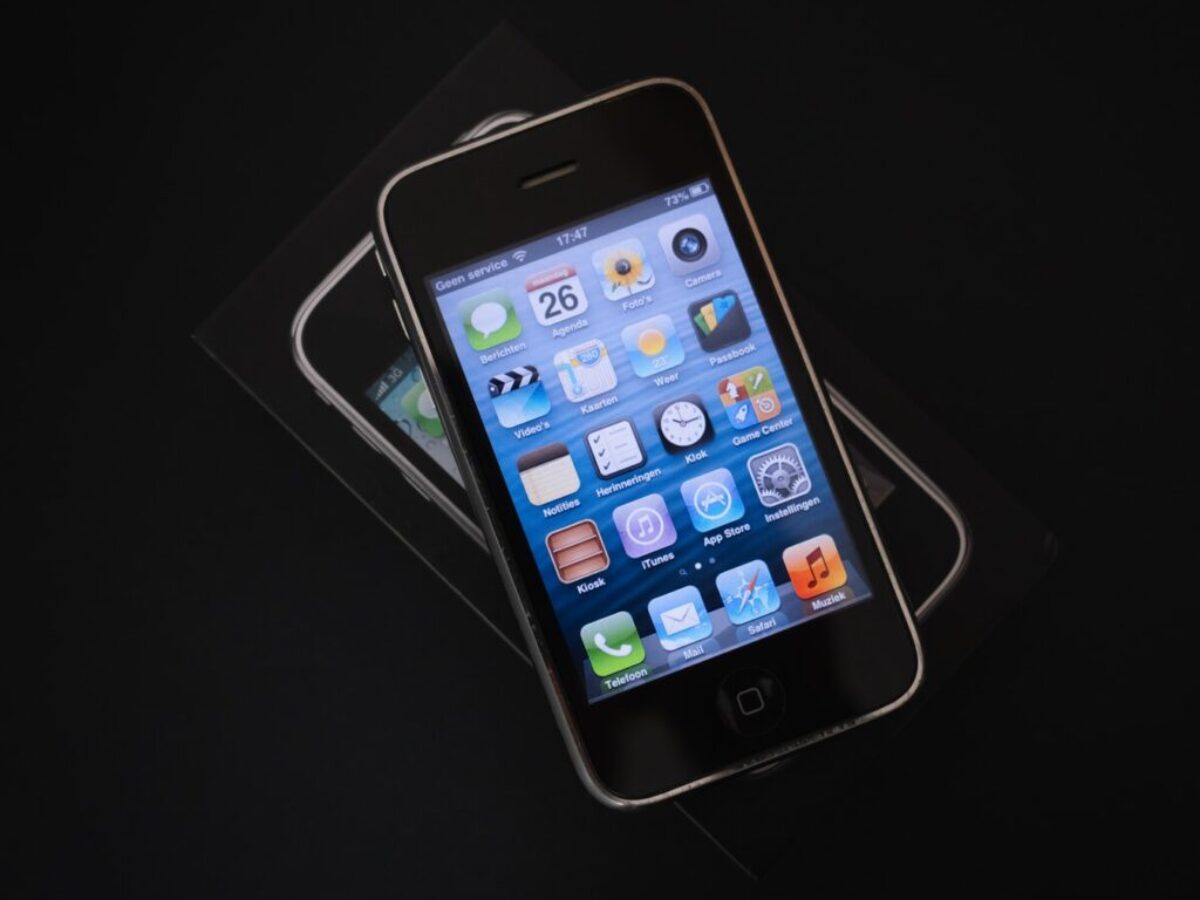 black iphone 4 on white table