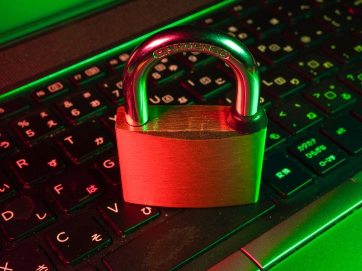 red padlock on black computer keyboard