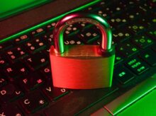 red padlock on black computer keyboard