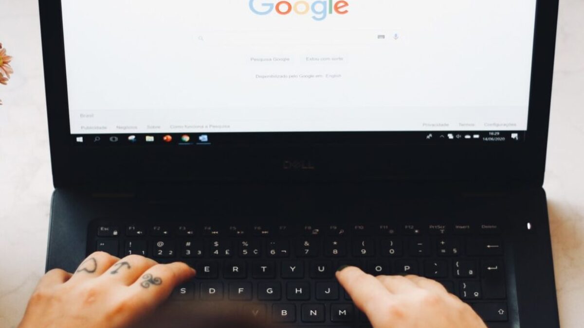 person using black laptop computer
