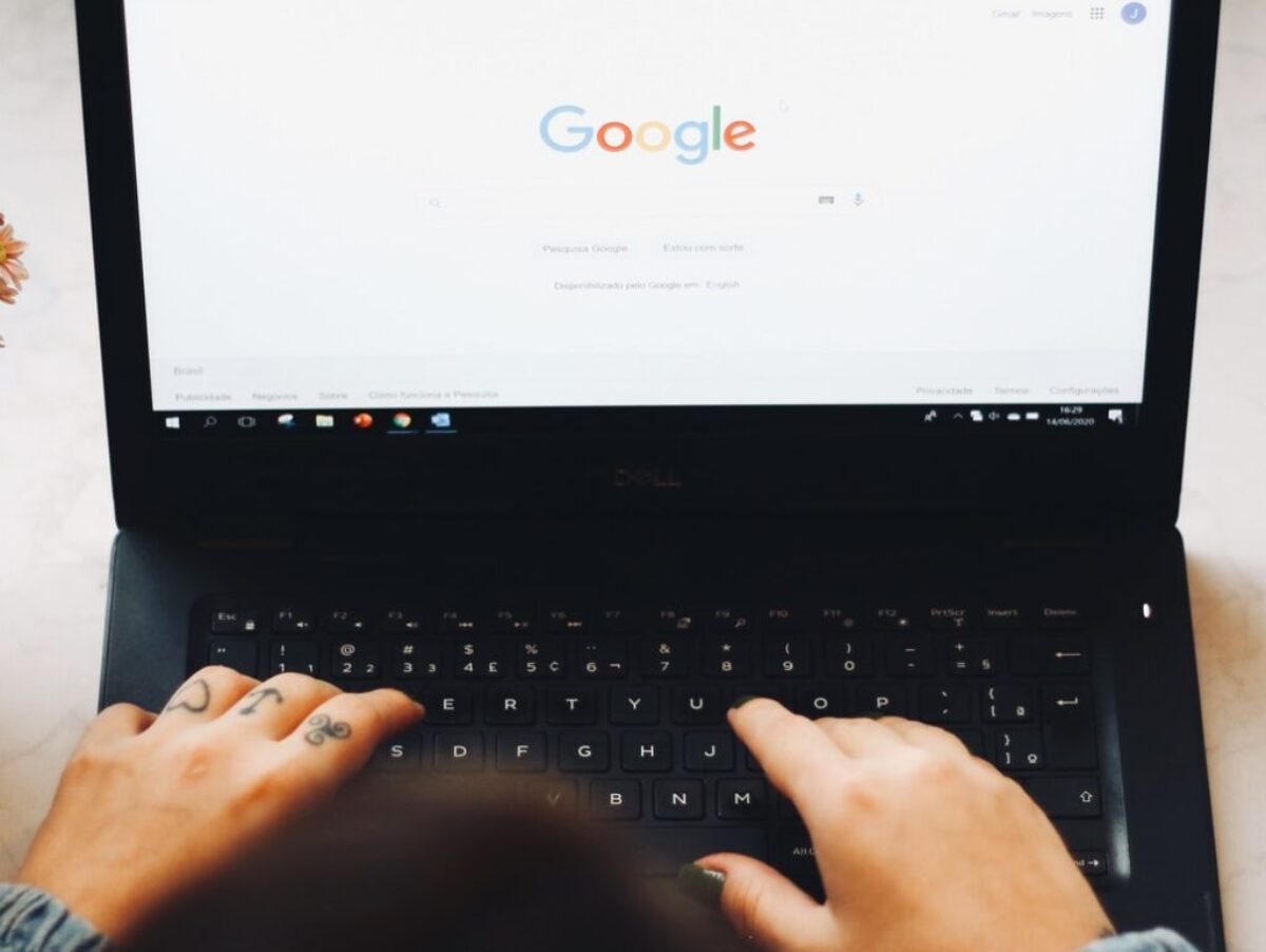 person using black laptop computer