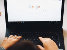 person using black laptop computer