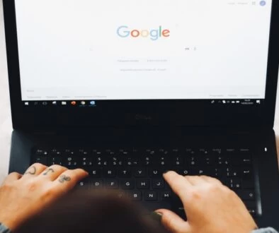 person using black laptop computer
