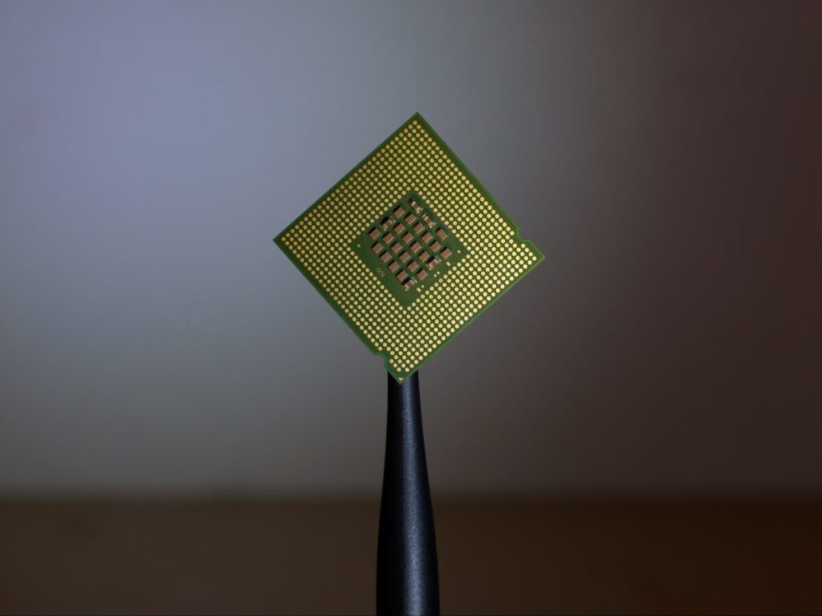 person holding computer cell processor