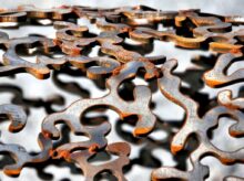 shallow focus photography of gray cut-out metal frame