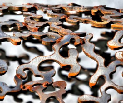shallow focus photography of gray cut-out metal frame