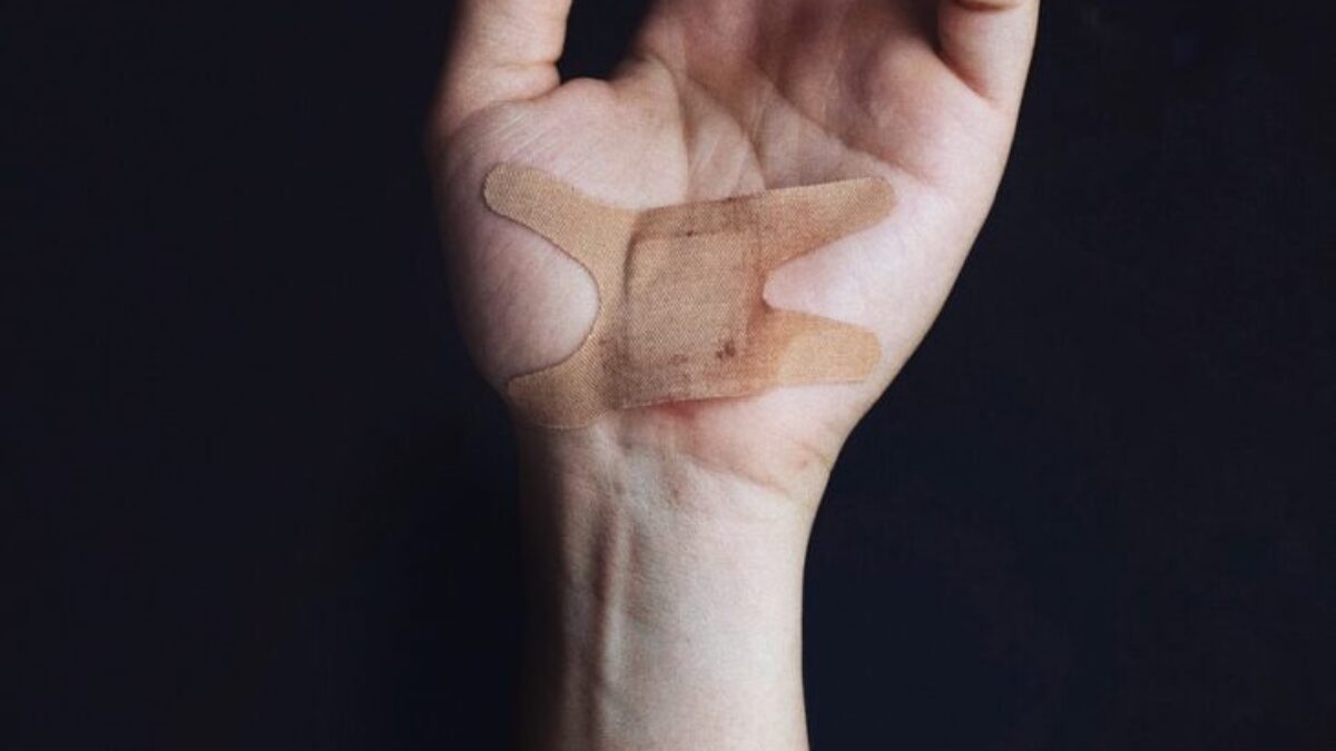 person's left palm with bandage