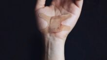 person's left palm with bandage