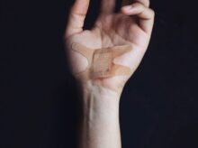 person's left palm with bandage