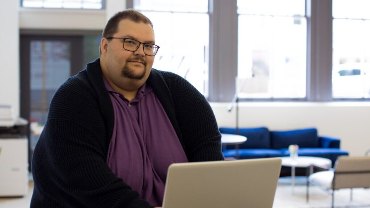 close-up photography of man using laptop