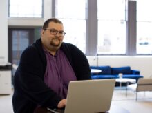 close-up photography of man using laptop