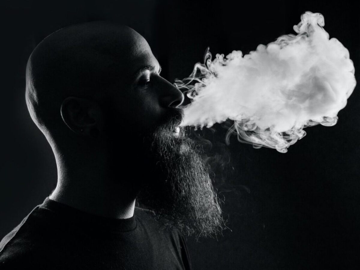 man smoking with black background