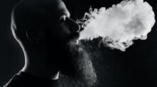 man smoking with black background