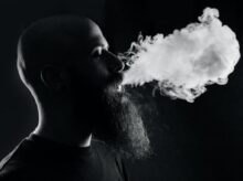 man smoking with black background