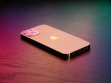 Silver Iphone 6 on Black Book