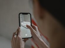 Person Holding Black Iphone