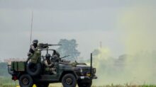A Soldier Driving Military Vehicle