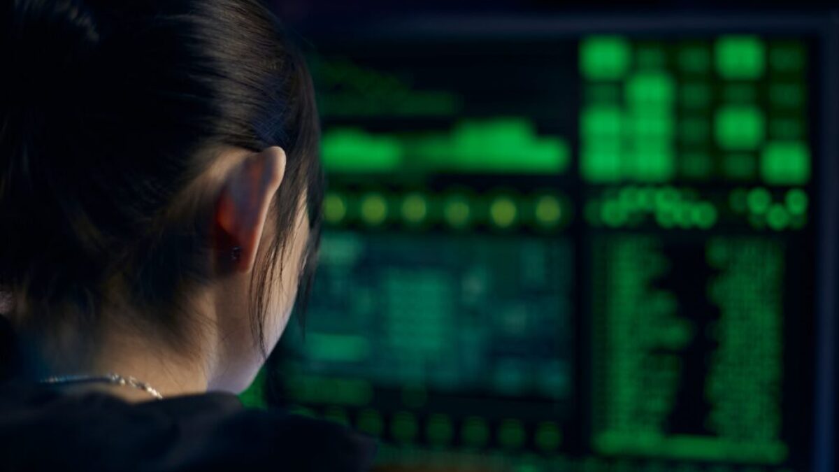 Woman in Black Shirt Looking at Neon Lights