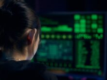 Woman in Black Shirt Looking at Neon Lights