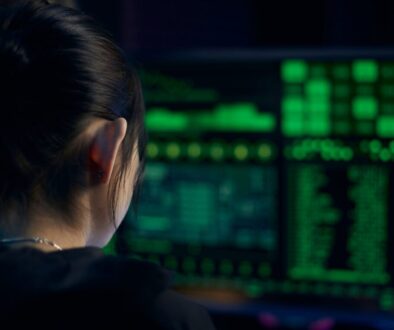Woman in Black Shirt Looking at Neon Lights