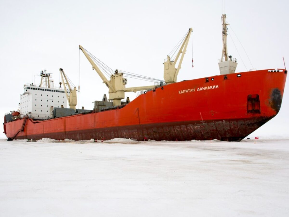 red and white ship on sea during daytime