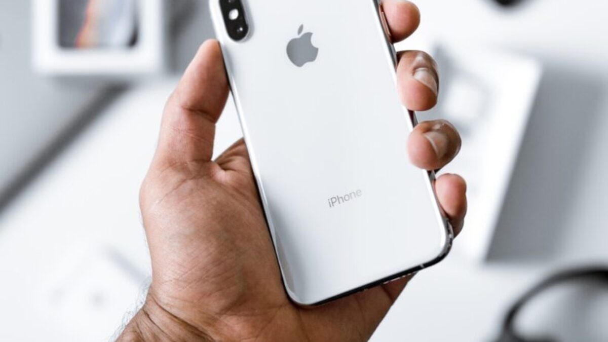 person holding silver iPhone X