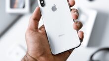 person holding silver iPhone X