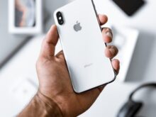 person holding silver iPhone X