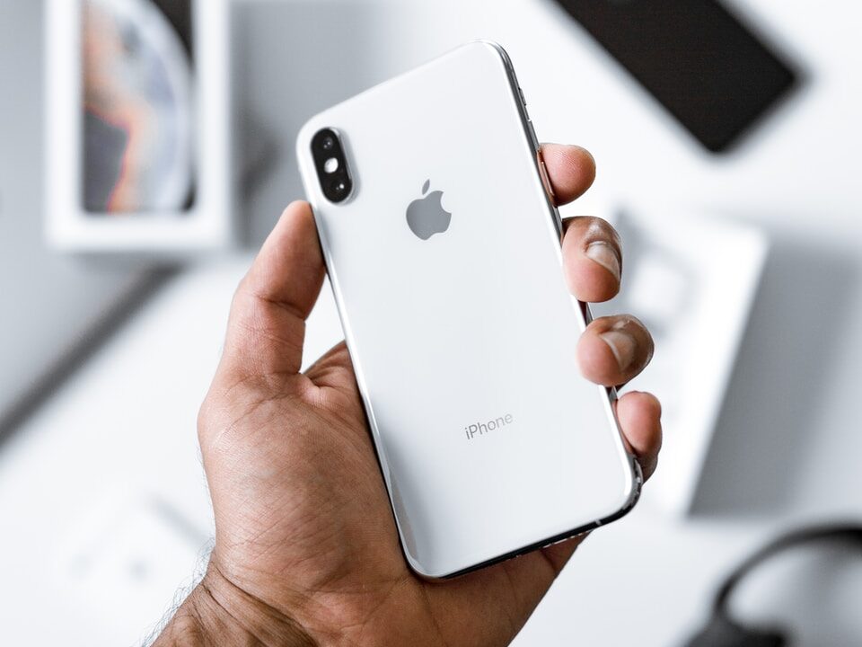 person holding silver iPhone X