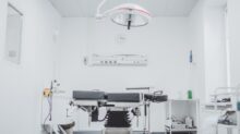black and white hospital bed in the middle of interior building