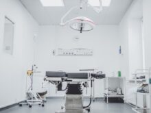 black and white hospital bed in the middle of interior building