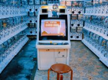 black flat screen tv on white wooden tv rack