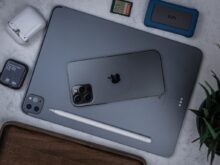 silver ipad on brown wooden table