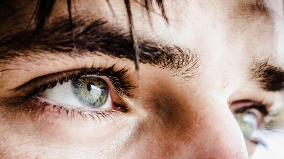 close up photo of gray-eyed man