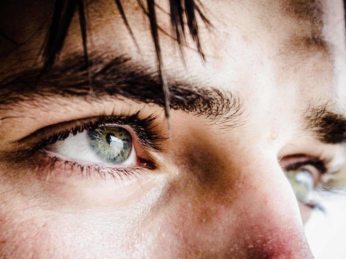 close up photo of gray-eyed man