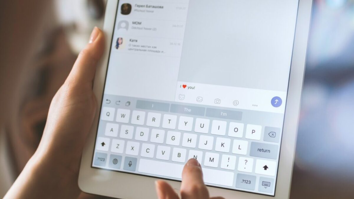 person using white iPad