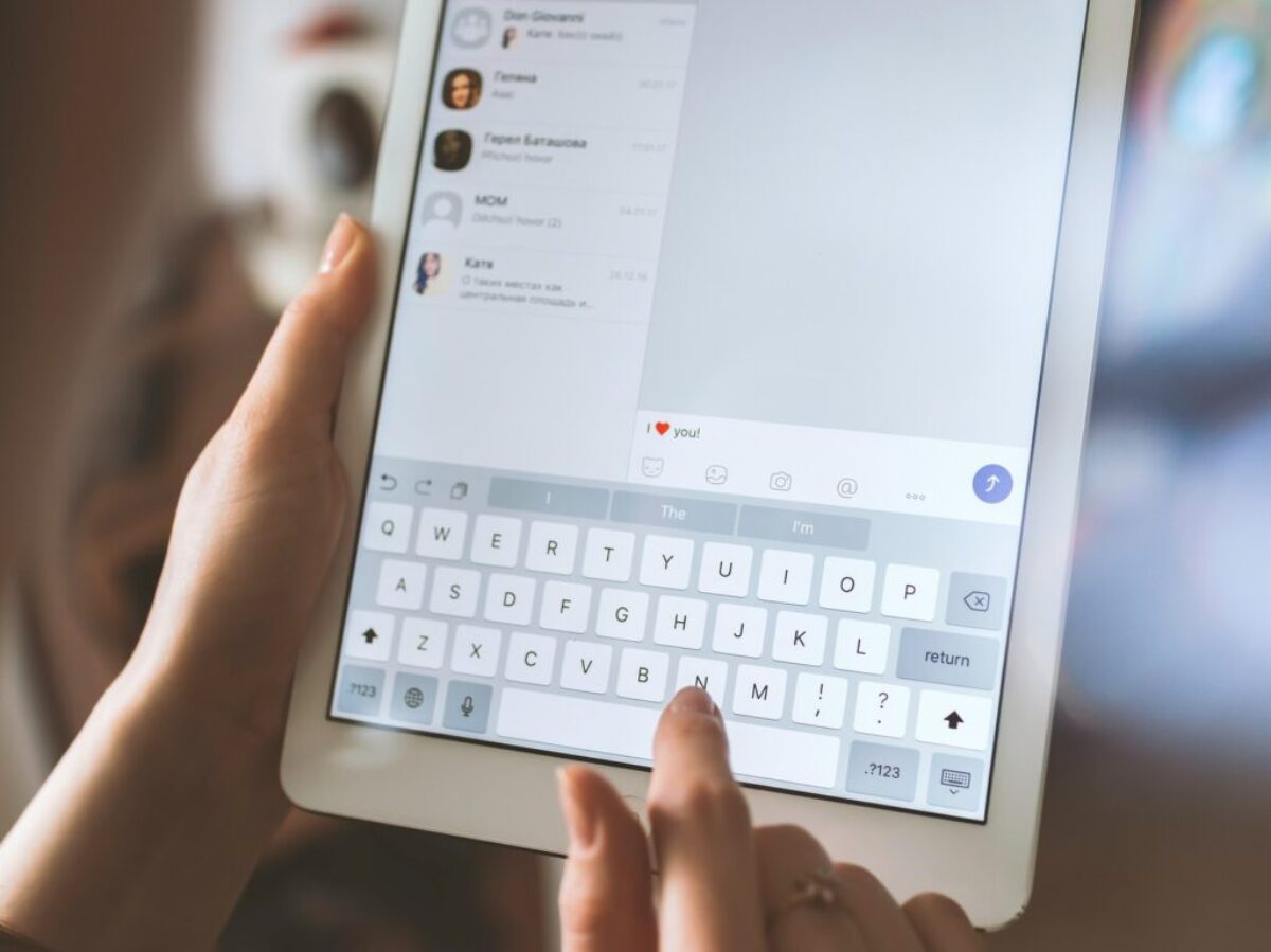 person using white iPad