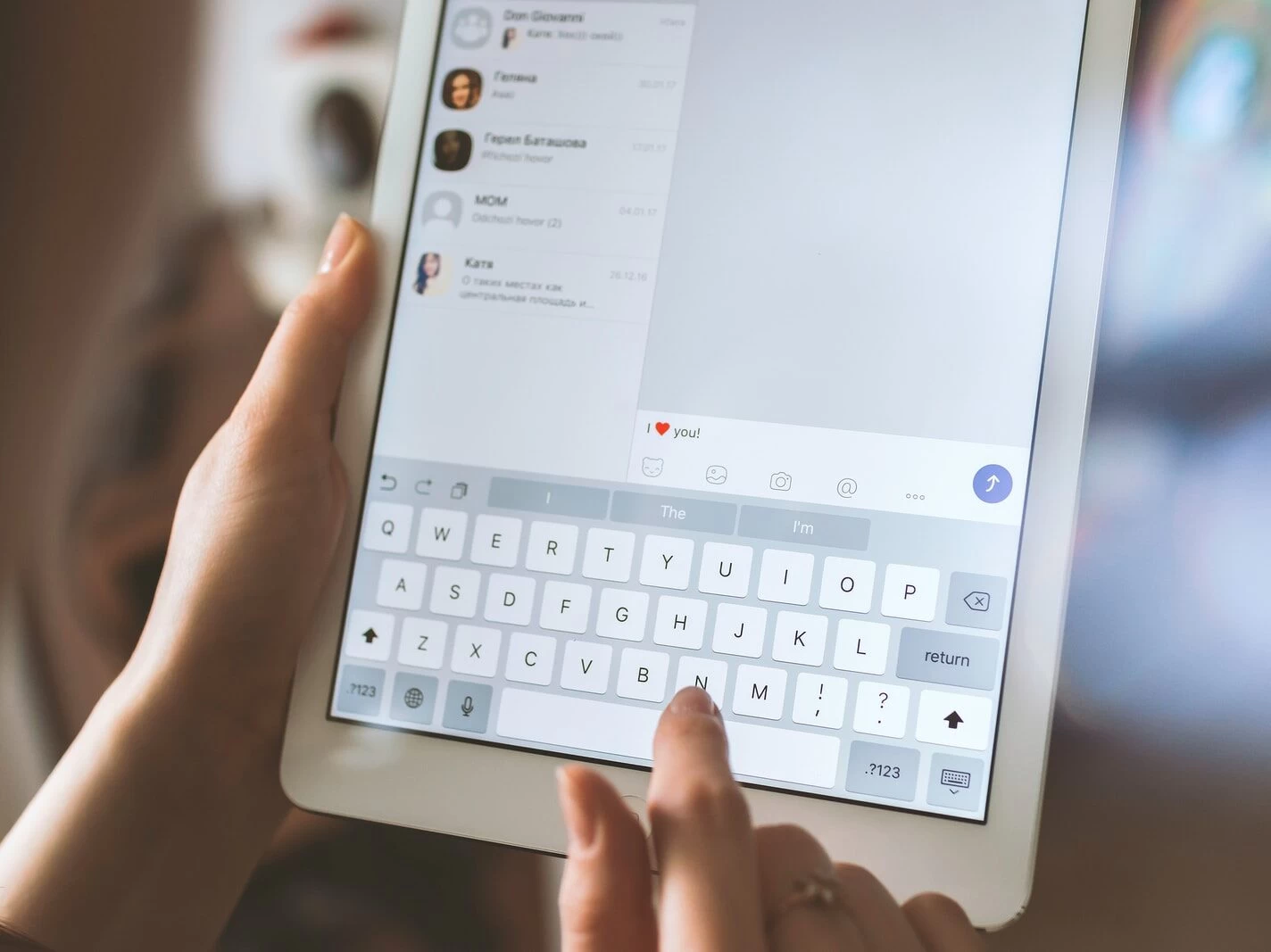 person using white iPad