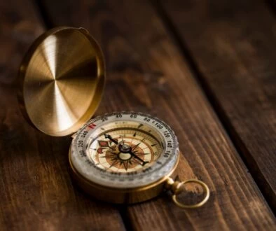 shallow focus photo of compass
