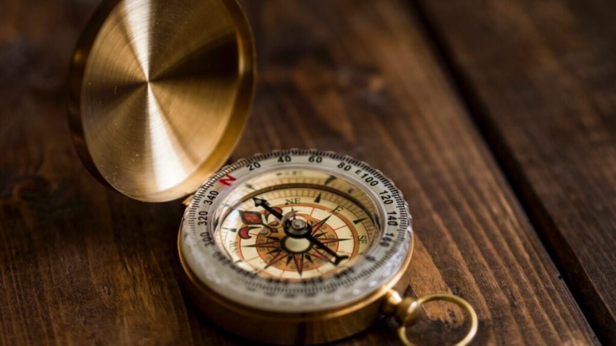 shallow focus photo of compass