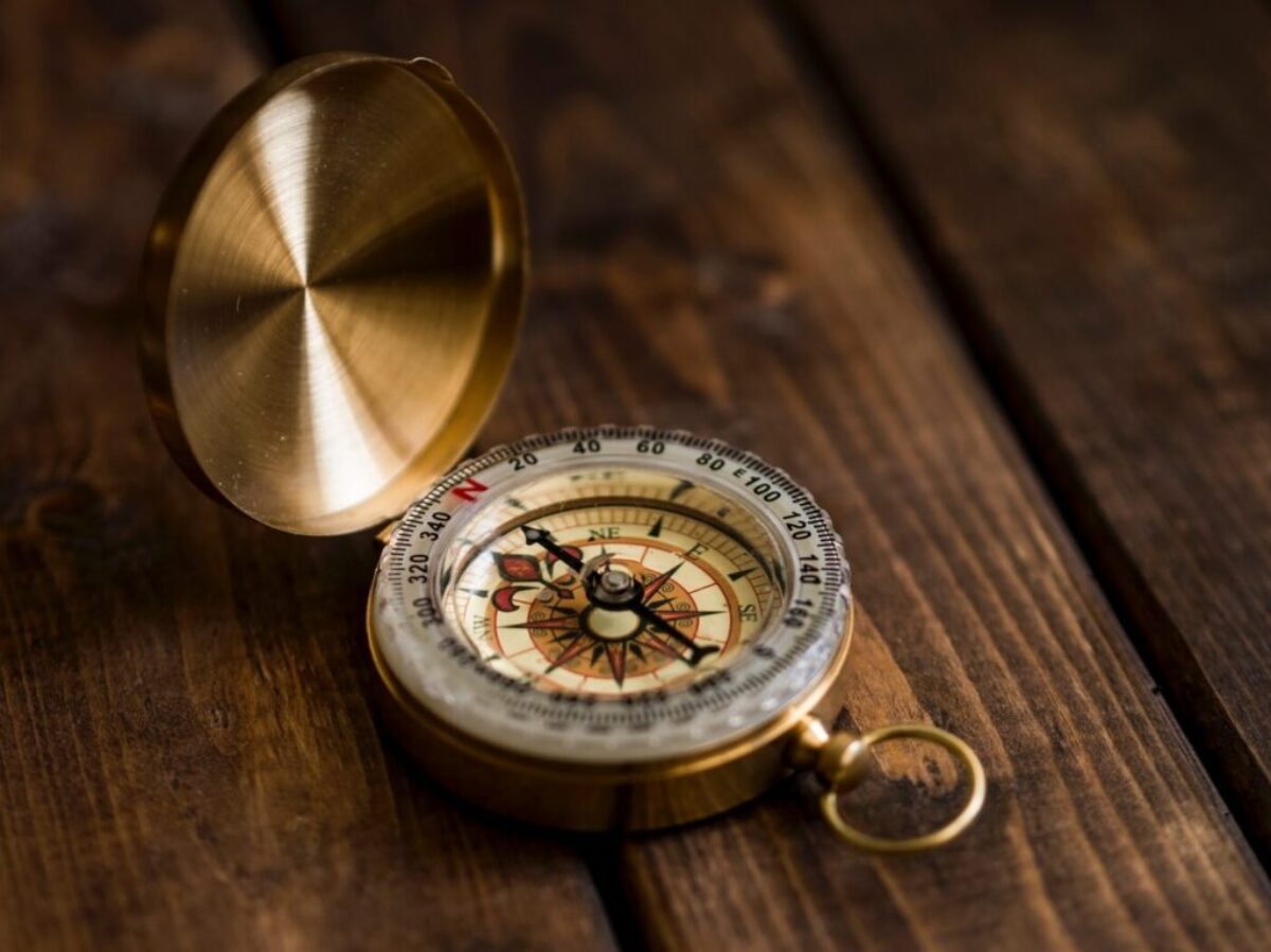 shallow focus photo of compass