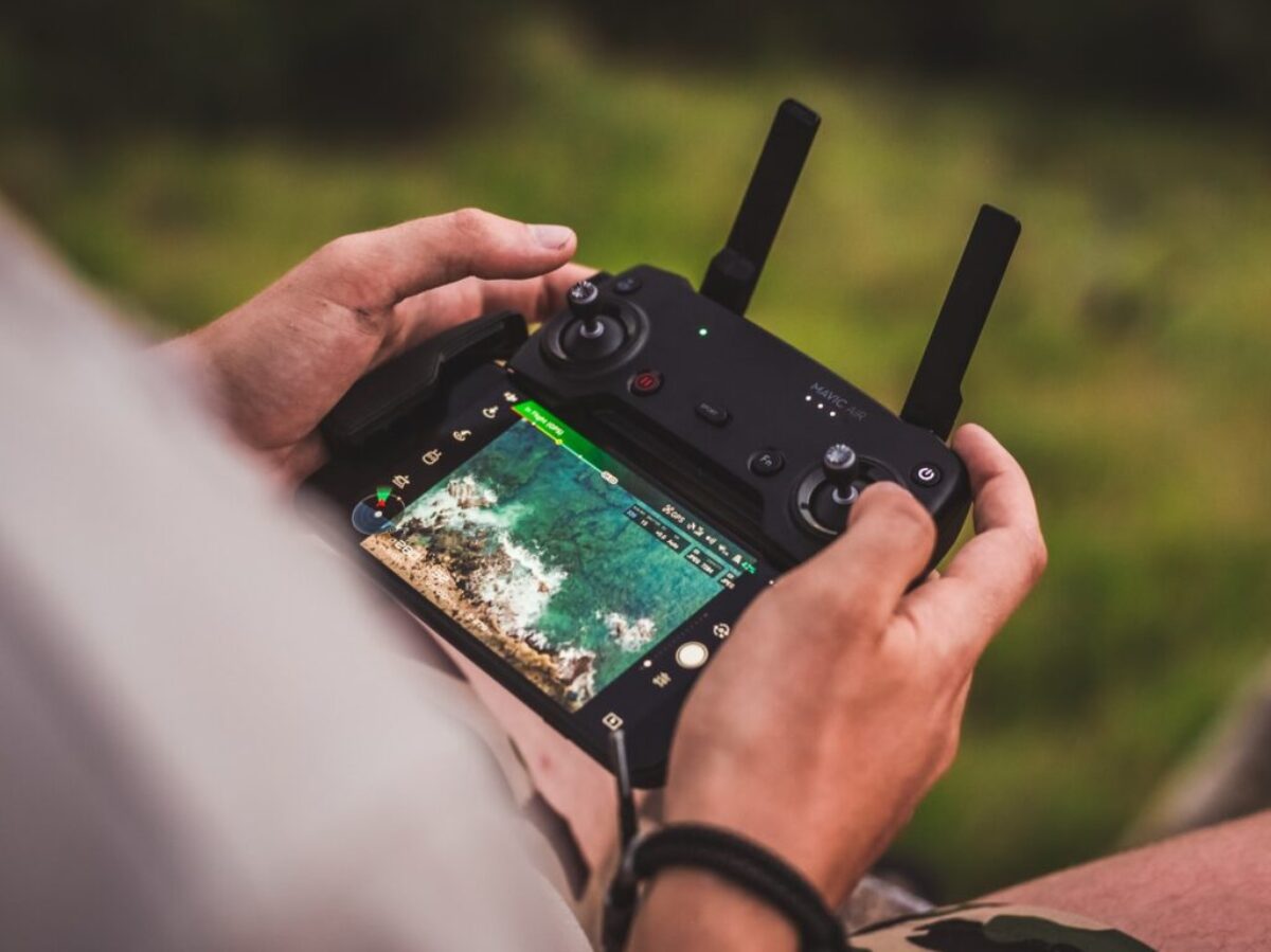 person playing game with joystick controller