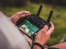 person playing game with joystick controller